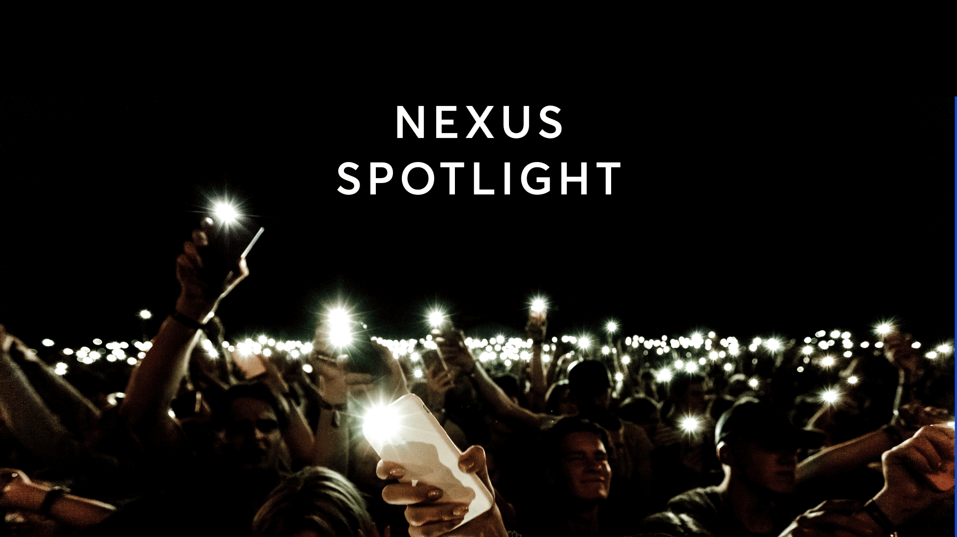 fans shining light through phone at concert