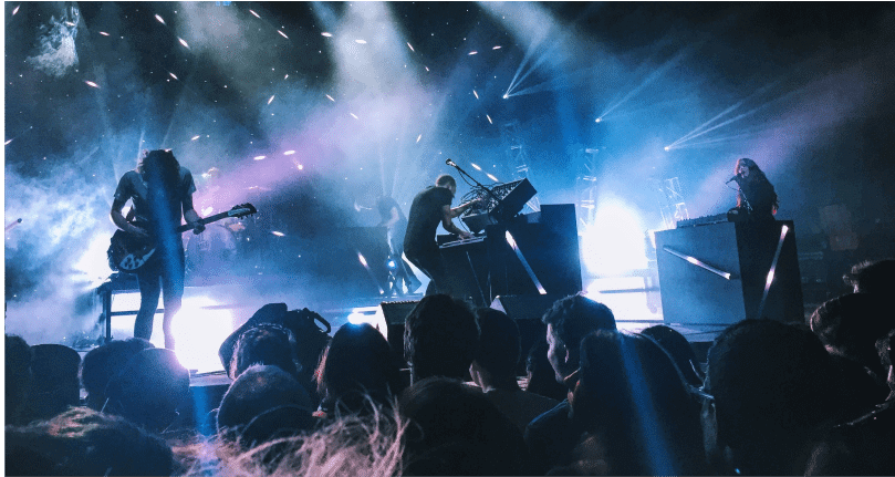 fans at concert during nighttime